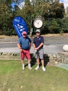 tow male golfers in navy tops