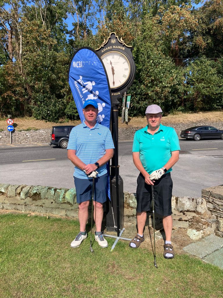 2 male golfers in blue topss